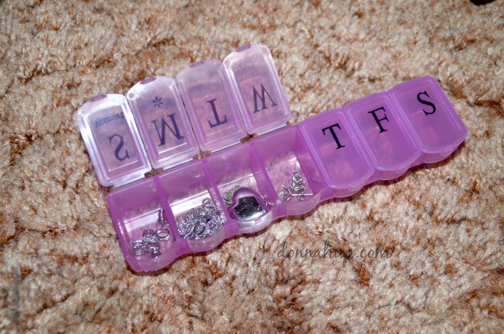 Jewelry in a pill container.